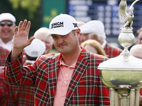 Jason Kokrak celebrates by wearing the Colonial Country Club plaid jacket after winning the 2021 Charles Schwab Challenge on May 30, 2021 in Fort Worth, Texas.
