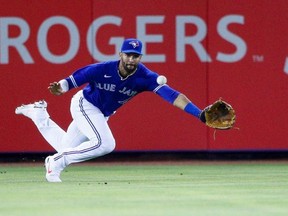 Jays left fielder Lourdes Gurriel Jr. dives for the ball against the Atlanta Braves in the fifth inning at TD Ballpark. USA TODAY Sports