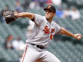 Orioles starting pitcher John Means throws against the Mariners during the first inning at T-Mobile Park in Seattle, Wednesday, May 5, 2021.