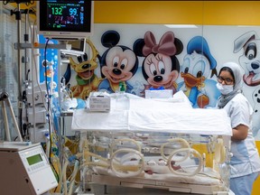 A member of the medical staff checks one of nine babies kept incubators, a day after they were born to a Malian woman at clinic in the western Moroccan city of Casablanca, on May 5, 2021.