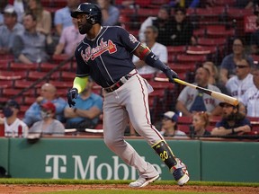 Atlanta Braves left fielder Marcell Ozuna watches his RBI double against the Boston Red Sox at Fenway Park.