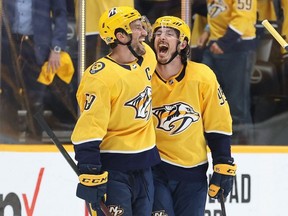 Predators defenceman Roman Josi (left) celebrates with Matt Duchene (right) after Duchene scored the game winning goal in the second overtime period for a 5-4 win against the Hurricanes in Game 3 of the First Round of the 2021 Stanley Cup Playoffs at Bridgestone Arena in Nashville, Friday, May 21, 2021.