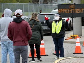 Residents living in Ottawa hot spots Overbrook and Vanier get their vaccine at a pop-up clinic at the Howard Darwin Centennial Arena on May 11, 2021.