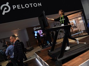 Maggie Lu uses a Peloton Tread treadmill during CES 2018 at the Las Vegas Convention Center on Jan. 11, 2018 in Las Vegas, Nevada.