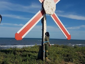 A photo obtained by Reuters on May 8, 2021, said to be shot March 2019 at Solenzara Air Base, Corsica, France, shows a man tied to a target on a firing range.