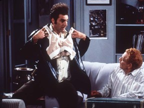 Kramer (Michael Richards) and Frank Costanza (Jerry Stiller, right) discuss their invention, the bro on the television series Seinfeld.