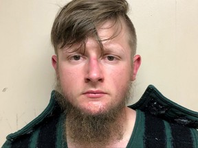 Robert Aaron Long, 21, of Woodstock in Cherokee County poses in a jail booking photograph after he was taken into custody by the Crisp County Sheriff's Office in Cordele, Ga., March 16, 2021.
