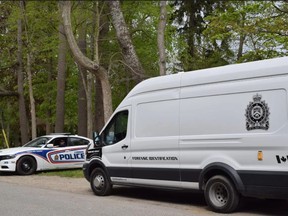 London police vehicles are shown at a home near the Patricia Avenue-University Crescent home King's University College. A man was killed in a stabbing. Calvi Leon/The London Free Press