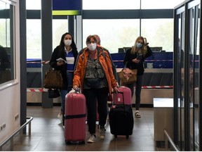 Passengers of TUI Airways flight from Dusseldorf arrive at Ioannis Kapodistrias International Airport, as the country's tourism season officially opens, on the island of Corfu, Greece, May 15, 2021.