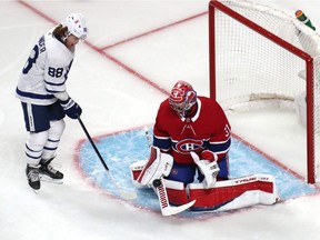 Carey Price makes a save against Toronto Maple Leafs centre William Nylander during the third period in Game 6 of the first round of the 2021 Stanley Cup Playoffs at the Bell Centre on Saturday, May 29, 2021.