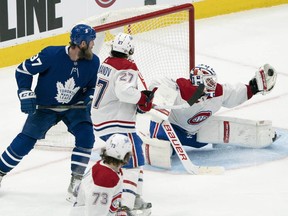 Canadiens goaltender Jake Allen make a nice glove save during the third period against the Leafs at Scotiabank Arena in Toronto.