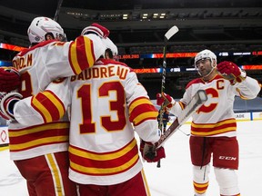 Calgary Flames Johnny Gaudreau (13) celebrates his goal with teammates during second period NHL action against the Edmonton Oilers on Saturday, May 1, 2021 in Edmonton. Greg Southam-Postmedia