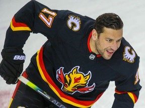 Calgary Flames Milan Lucic during warm-up before a game against the Winnipeg Jets in NHL hockey in Calgary on Friday March 26, 2021. Al Charest / Postmedia