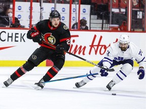 Ottawa Senators centre Logan Brown (27) and Toronto Maple Leafs left wing Nick Foligno (71) fight for the puck during first-period action at the Canadian Tire Centre on Wednesday night.