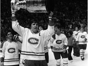 Montreal Canadiens' captain Serge Savard leads the parade of his teamates carrying the Stanley Cup around the ice after the Canadiens won the championship for the fourth consecutive times in Montreal, May 21, 1979 against the Rangers. (CP PHOTO/Arne Glassbourg) ORG XMIT: 906011
