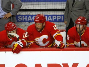 The Flames are dejected on the bench as they are down 3-0 to the Winnipeg Jets after two periods in NHL action at the Scotiabank Saddledome in this photo from May 5.