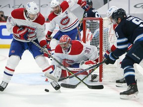 Canadiens goaltender Carey Price makes a save off Andrew Copp of the Jets in Game 2 of the second round of the 2021 Stanley Cup Playoffs at Bell MTS Place in Winnipeg, Friday, June 4, 2021.