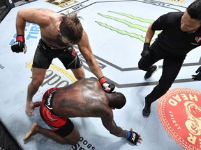 Tanner Boser of Canada, left, punches Ovince Saint Preux in a heavyweight fight during the UFC Fight Night event at UFC APEX on June 26, 2021 in Las Vegas, Nevada.