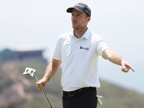 Russell Henley of the United States reacts to his par on the 17th green during the first round of the 2021 U.S. Open at Torrey Pines Golf Course (South Course) on Friday.