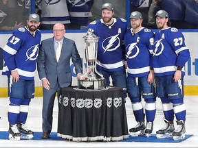 NHL deputy commissioner Bill Daly presents Alex Killorn, Ryan McDonagh, Victor Hedman and Steven Stamkos of the Tampa Bay Lightning with the Prince of Wales Trophy.