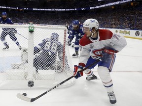 Jake Evans #71 of the Montreal Canadiens carries the puck against the Tampa Bay Lightning during the third period in Game 1 of the 2021 NHL Stanley Cup Final at Amalie Arena in Tampa, Florida.