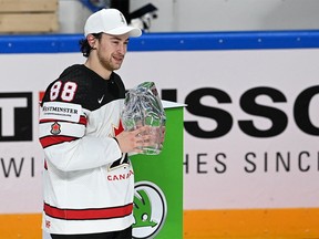 Canada forward Andrew Mangiapane poses with the trophy for best player during the ceremony after the IIHF Men's Ice Hockey World Championships final match between the Finland and Canada at the Arena Riga in Riga, Latvia, on June 5, 2021. - A 3-2 victory over Finland crowned Canada Ice Hockey World Champions 2021.