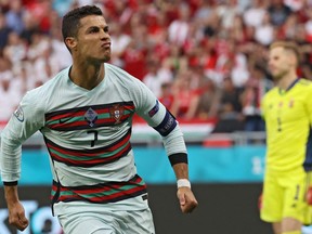 Portugal's forward Cristiano Ronaldo celebrates after scoring his team's second goal during the UEFA EURO 2020 Group F football match between Hungary and Portugal at the Puskas Arena in Budapest on June 15, 2021.