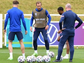 England's forward Harry Kane (C) and England's forward Raheem Sterling (R) attend their training session at the Tottenham Hotspur training ground in London on June 17, 2021 on the eve of the UEFA EURO 2020 Group D football match between England and Scotland.