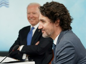 U.S. President Joe Biden and Canada's Prime Minister Justin Trudeau attend a session during the G7 summit in Carbis Bay, Cornwall, Britain, June 11, 2021.