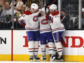 Canadiens forward Cole Caufield (centre) is congratulated by teammates Nick Suzuki (right) and Corey Perry after scoring a goal against the Golden Knights during the second period in Game 5 of the Stanley Cup Semifinals at T-Mobile Arena in Las Vegas, Tuesday, June 22, 2021.