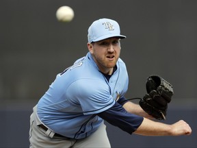 In this Feb. 27, 2020, file photo, Tampa Bay Rays' Tyler Zombro delivers a pitch during the sixth inning of a spring training baseball game against the New York Yankees in Tampa, Fla.