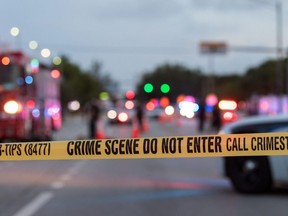 Police investigate the scene where a pickup truck drove into a crowd of people at a Pride parade in Wilton Manors, Fla., Saturday, June 19, 2021.