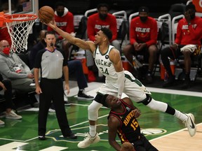 Giannis Antetokounmpo of the Milwaukee Bucks goes up for a shot against Clint Capela of the Atlanta Hawks during the second half in game two of the Eastern Conference Finals at Fiserv Forum on June 25, 2021 in Milwaukee, Wis.