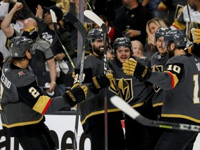 Mattias Janmark (centre) of the Golden Knights is congratulated by teammates after scoring a goal against the Canadiens during the second period in Game 1 of the Stanley Cup Semifinals at T-Mobile Arena in Las Vegas, Monday, June 14, 2021.