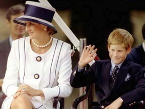 Princess Diana and her son Harry watch veterans as they march past a dais on the Mall as part of the commemorations of VJ Day.