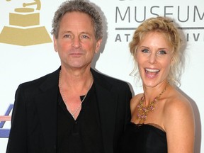 Lindsey Buckingham from Fleetwood Mac arrives with his wife Kristen Buckingham at the Nokia Theater in downtown Los Angeles, Dec. 3, 2008, to attend the announcement of nominations for the 51st Annual Grammy Awards.