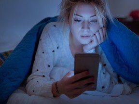 Teenage Girl reading Text Message