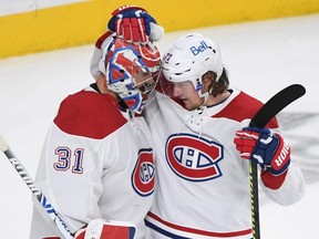 Tyler Toffoli of the Montreal Canadiens (right) congratulates goaltender Carey Price after the Canadiens defeated the Vegas Golden Knights in Game 5 of the Stanley Cup Semifinals at T-Mobile Arena on June 22, 2021 in Las Vegas.