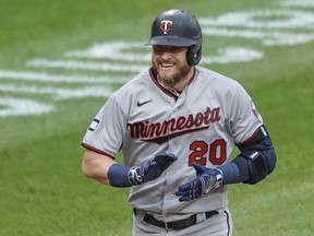 Minnesota Twins third baseman Josh Donaldson smiles as he rounds the bases after hitting a two run home run against the Chicago White Sox during the first inning at Guaranteed Rate Field in Chicago, June 29, 2021.