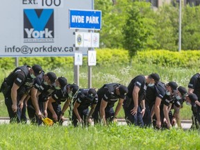 Eleven London police officers search for evidence along the southbound lanes of Hyde Park Road near South Carriage Road in northwest London as part of the investigation into the deaths of four members of a London family who were struck by a pickup truck while walking Sunday evening. A nine-year-old boy was the only survivor of an act police said they believe was motivated by anti-Muslim hate. Photograph taken on Monday June 7, 2021 (Mike Hensen/The London Free Press)