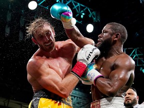 Floyd Mayweather Jr. fights Logan Paul during an exhibition boxing match at Hard Rock Stadium.