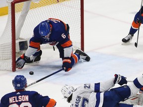 New York Islanders defenceman Ryan Pulock makes a last-second save along the goal line to secure a win against the Tampa Bay Lightning during the third period of Game 4 of their series on Saturday.