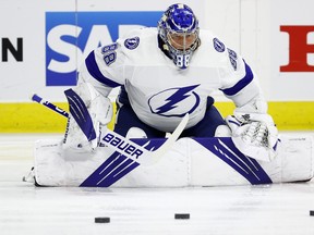 Tampa Bay Lightning goaltender Andrei Vasilevskiy stretches ahead of Game 5 against the Carolina Hurricanes on Tuesday. With a 29-save, 2-0 win, he became the first goaltender in NHL history to string together three consecutive series clinching shutouts.