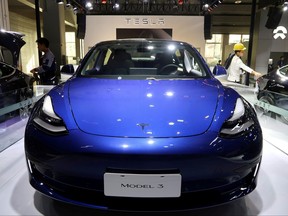 A China-made Tesla Model 3 electric vehicle is seen ahead of the Guangzhou auto show in Guangzhou, Guangdong province, China, Nov. 21, 2019.