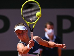 Czech Republic's Barbora Krejcikova returns the ball to Sloane Stephens of the US during their women's singles fourth round tennis match on Day 9 of The Roland Garros 2021 French Open tennis tournament in Paris on June 7, 2021.