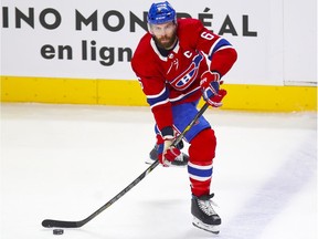 Montreal Canadiens captain Shea Weber carries the puck up during first period against the Calgary Flames in Montreal on April 14, 2021.