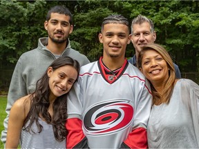 Robert Orr with his family members, brother James, sister Samantha, left, mom Sharon John and father John Orr at home in Beaconsfield. Orr, a Halifax Moosehead in the QMJHL, was drafted by the NHL Carolina Hurricanes.