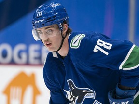 Kole Lind of the Vancouver Canucks waits for a faceoff against the Edmonton Oilers during an April 16, 2021 NHL game at Rogers Arena.