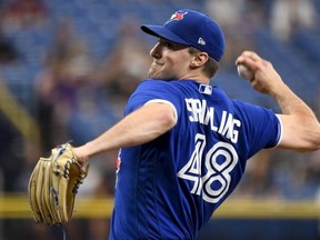 Ross Stripling of the Toronto Blue Jays throws a pitch during the first inning against the Tampa Bay Rays at Tropicana Field on July 10, 2021 in St Petersburg, Florida.