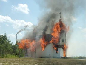 A former Polish Roman Catholic church near Redberry Lake, about 90 kilometres northwest of Saskatoon, burns to the ground on Thursday, July 8, 2021. (Lynn Swystun)